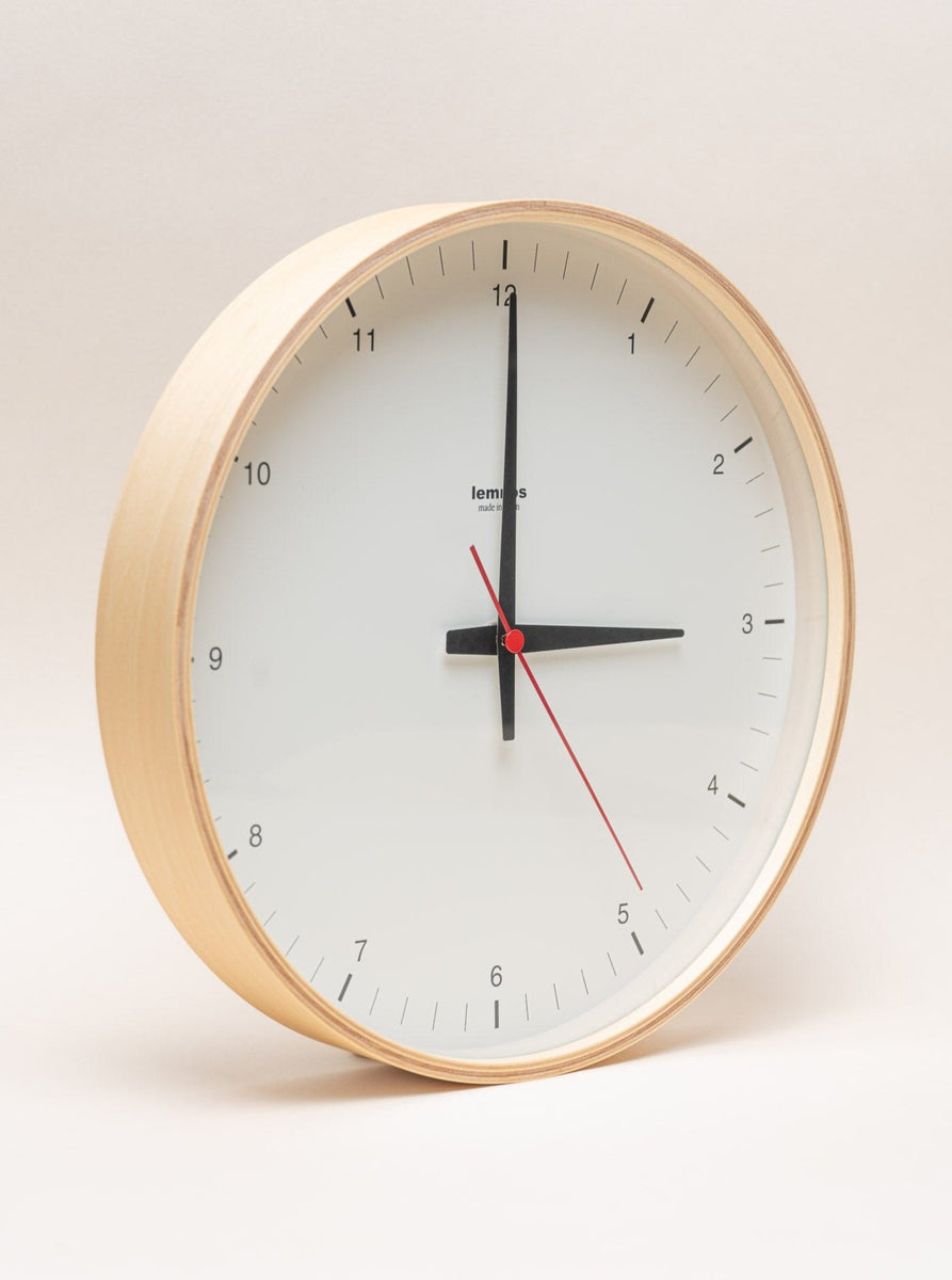 A Lemnos Plywood Clock on a white background.